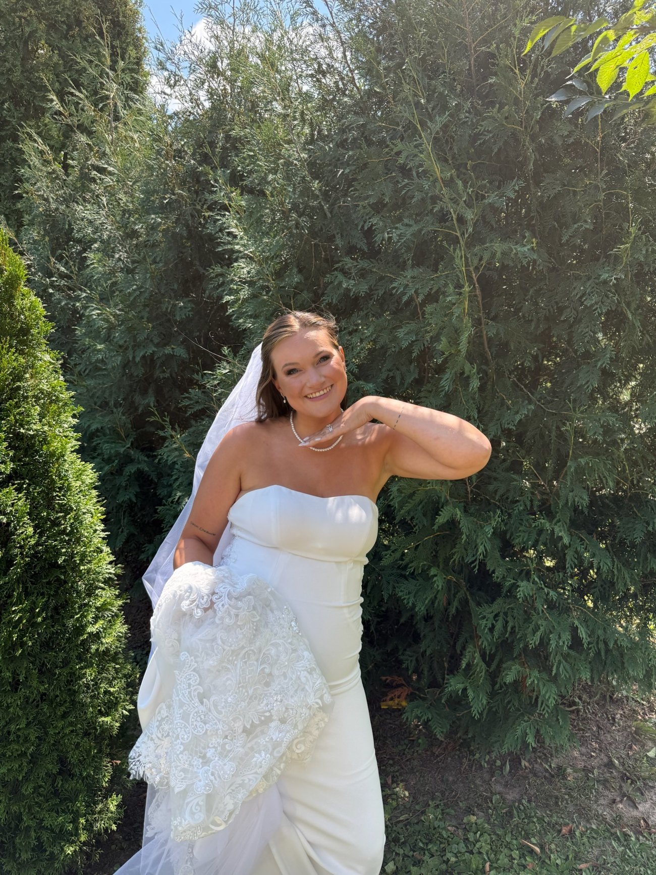 April, founder of The Bridal Edit, smiling in her wedding dress